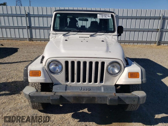 2006 Jeep Wrangler Sport Right Hand Drive with VIN 1J4F449S76P747454, listed as a Copart auction lot 77819214 with 184,763 mi miles and Salvage Title. Bid and sale history available at carsss.com. Image 5.