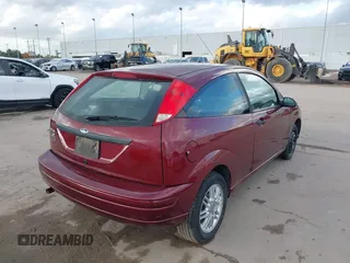 2007 Ford Focus S z VIN 1FAFP31N27W231884, wystawiony jako IAAI lot #41138534 z przebiegiem 84 506 mil mil oraz . Historia ofert i sprzedaży dostępna na DreamBid. Obrazek 4.
