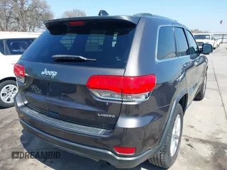 2015 Jeep Grand Cherokee Altitude with VIN 1C4RJEAG0FC952260, listed as a IAAI auction lot 41738692 with 124,197 mi miles. Bid and sale history available at carsss.com. Image 4.