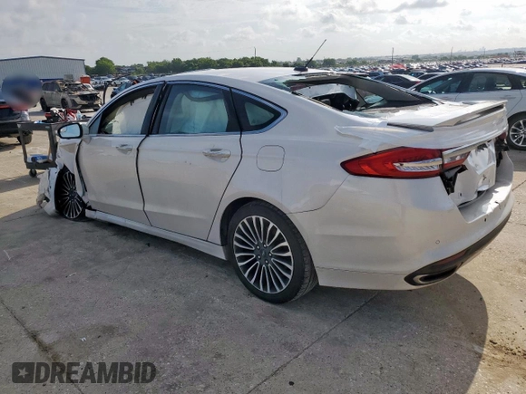 2018 Ford Fusion Titanium с VIN 3FA6P0K94JR275623, выставлен на аукционе Copart как лот 59639215 с пробегом 84 919 миль миль и Списание • Salvage title. История ставок и продаж доступна на DreamBid. Изображение 2.