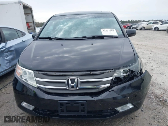 2012 Honda Odyssey Touring with VIN 5FNRL5H96CB058828, listed as a IAAI auction lot 41731389 with 152,295 mi miles and . Bid and sale history available at DreamBid. Image 12.