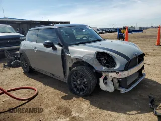 2015 MINI Hardtop with VIN WMWXM5C5XFT974077, listed as a Copart auction lot 58063965 with 93,853 mi miles and Salvage title. Bid and sale history available at DreamBid. Image 4.