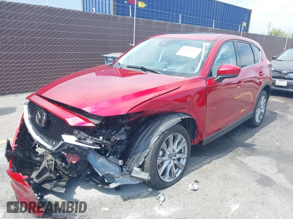 2021 Mazda CX-5 Grand Touring with VIN JM3KFADM6M1373111, listed as a IAAI auction lot 42784431 with 14,374 mi miles and . Bid and sale history available at DreamBid. Image 19.