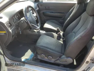 2007 Hyundai Accent SE z VIN KMHCN36C47U027122, wystawiony jako Copart lot #52224605 z przebiegiem 169 022 mil mil oraz Szkoda całkowita • Salvage title. Historia ofert i sprzedaży dostępna na DreamBid. Obrazek 7.