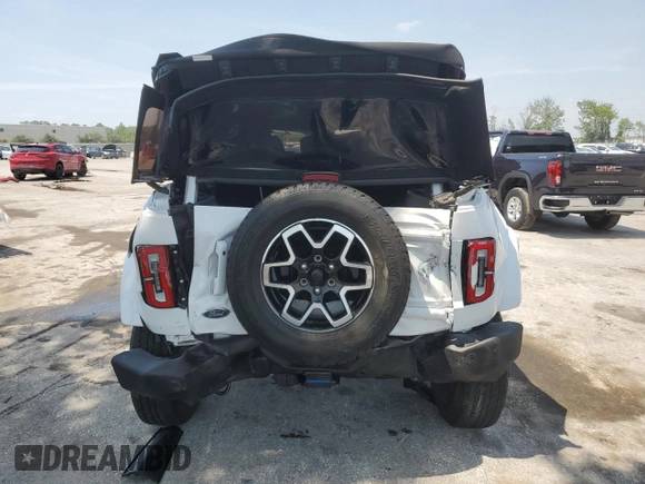 2021 Ford Bronco with VIN 1FMEE5BP2MLA94820, listed as a Copart auction lot 52015085 with 33,606 mi miles and Salvage title. Bid and sale history available at DreamBid. Image 6.