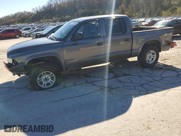 2004 Dodge Dakota Sport z VIN 1D7HG38K94S556894, wystawiony jako Copart lot #79743994 z przebiegiem 174 933 mil mil oraz Szkoda całkowita • Salvage title. Historia ofert i sprzedaży dostępna na DreamBid. Obrazek 1.