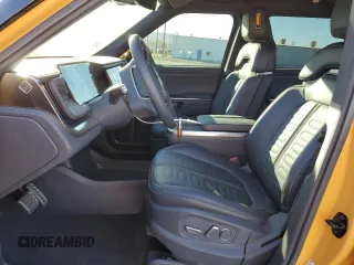 2023 Rivian R1S Launch Edition with VIN 7PDSGABL3PN007354, listed as a Copart auction lot 87954795 with 13,158 mi miles and Salvage Title. Bid and sale history available at carsss.com. Image 7.