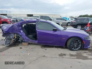 2023 Dodge Charger Scat Pack Widebody with VIN 2C3CDXGJ5PH699595, listed as a IAAI auction lot 41303894 with 1,828 mi miles and . Bid and sale history available at DreamBid. Image 14.