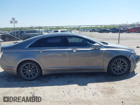 2014 Lincoln MKZ z VIN 3LN6L2G92ER835456, wystawiony jako IAAI lot #41985573 z przebiegiem 174 080 mil mil oraz . Historia ofert i sprzedaży dostępna na DreamBid. Obrazek 13.