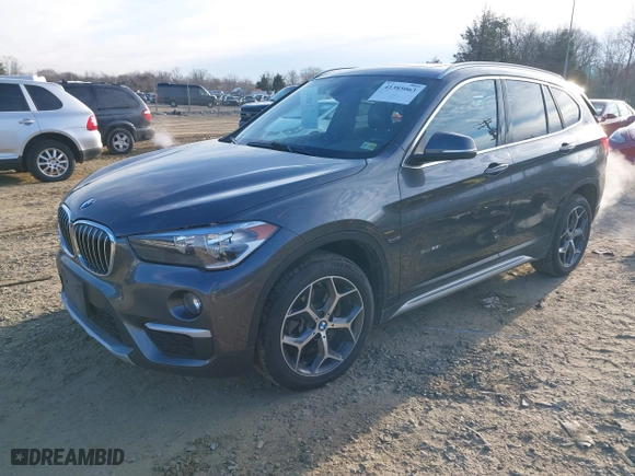 2018 BMW X1 xDrive28i with VIN WBXHT3C33J5F90349, listed as a IAAI auction lot 41385063 with 55,994 mi miles. Bid and sale history available at carsss.com. Image 18.