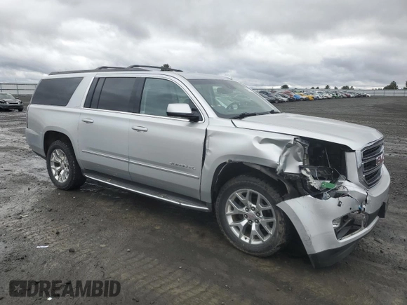 2015 GMC Yukon XL SLT with VIN 1GKS2HKC8FR616031, listed as a Copart auction lot 48740785 with 128,467 mi miles and Salvage Title. Bid and sale history available at carsss.com. Image 4.