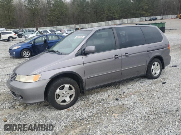 2000 Honda Odyssey EX with VIN 2HKRL1865YH513885, listed as a Copart auction lot 50223505 with 214,627 mi miles and Salvage Title. Bid and sale history available at DreamBid. Image 1.