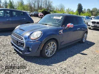 2014 MINI Hardtop S with VIN WMWXM7C51ET926090, listed as a Copart auction lot 55958745 with 148,997 mi miles and Salvage title. Bid and sale history available at DreamBid. Image 1.