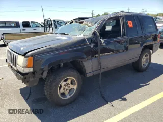 1998 Jeep Grand Cherokee Laredo with VIN 1J4GZ58S8WC292828, listed as a Copart auction lot 64335645 with Not provided miles and Salvage title. Bid and sale history available at DreamBid. Image 1.