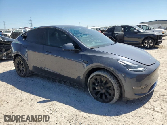 2023 Tesla Model Y Long Range z VIN 7SAYGDEE8PA185193, wystawiony jako Copart lot #48706215 z przebiegiem 10 451 mil mil oraz Szkoda całkowita • Salvage title. Historia ofert i sprzedaży dostępna na DreamBid. Obrazek 4.