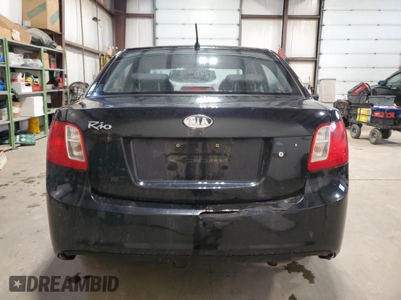 2010 Kia Rio with VIN KNADH4B37A6641845, listed as a Copart auction lot 51861215 with 163,894 mi miles and Salvage Title. Bid and sale history available at DreamBid. Image 6.