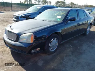 2004 Cadillac DeVille DHS z VIN 1G6KE57YX4U261849, wystawiony jako IAAI lot #41518835 z przebiegiem Nie podano mil oraz . Historia ofert i sprzedaży dostępna na DreamBid. Obrazek 2.