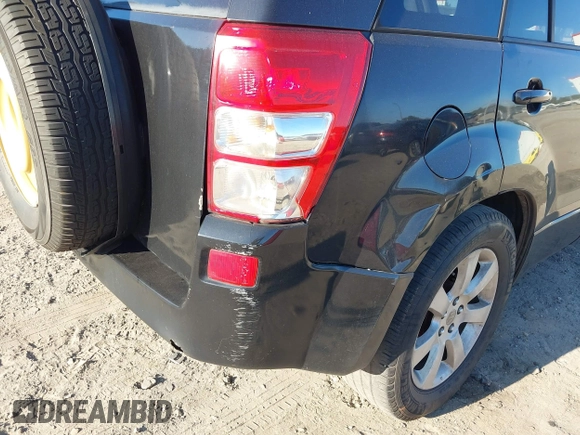 2011 Suzuki Grand Vitara Limited z VIN JS3TE0D72B4100152, wystawiony jako IAAI lot #40676416 z przebiegiem 193 097 mil mil oraz . Historia ofert i sprzedaży dostępna na DreamBid. Obrazek 6.