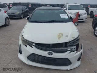 2016 Scion tC with VIN JTKJF5C75GJ016412, listed as a IAAI auction lot 42068497 with 1 mi miles. Bid and sale history available at carsss.com. Image 12.