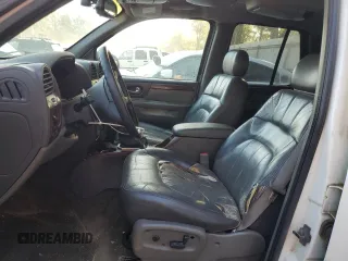 2002 GMC Envoy SLT with VIN 1GKDS13S822460095, listed as a Copart auction lot 77004764 with 267,716 mi miles and Salvage Title. Bid and sale history available at carsss.com. Image 7.