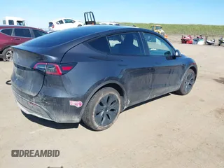 2024 Tesla Model Y with VIN 7SAYGDED8RF213796, listed as a IAAI auction lot 41634130 with 7,710 mi miles and . Bid and sale history available at DreamBid. Image 4.