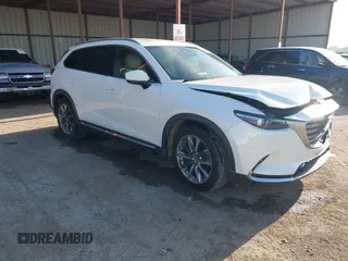 2016 Mazda CX-9 Grand Touring z VIN JM3TCADY6G0125547, wystawiony jako IAAI lot #41997445 z przebiegiem 129 179 mil mil oraz . Historia ofert i sprzedaży dostępna na DreamBid. Obrazek 1.