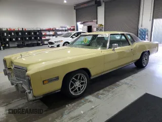 1975 Cadillac Eldorado z VIN 6L47S5Q413306, wystawiony jako Copart lot #47896175 z przebiegiem 2 691 mil mil oraz Czysty tytuł • Clean title. Historia ofert i sprzedaży dostępna na DreamBid. Obrazek 1.