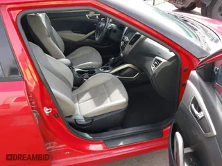 2013 Hyundai Veloster w/Black Int with VIN KMHTC6AD7DU117562, listed as a IAAI auction lot 41993745 with 106,780 mi miles. Bid and sale history available at carsss.com. Image 5.