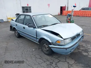1991 Toyota Corolla z VIN JT2AE94A7M3453218, wystawiony jako IAAI lot #42260354 z przebiegiem 162 562 mil mil oraz . Historia ofert i sprzedaży dostępna na DreamBid. Obrazek 1.