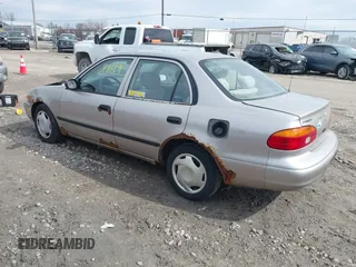 1999 Chevrolet Prizm z VIN 1Y1SK5488XZ446950, wystawiony jako IAAI lot #41798129 z przebiegiem 292 798 mil mil oraz . Historia ofert i sprzedaży dostępna na DreamBid. Obrazek 3.