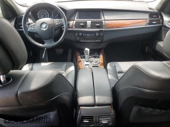 2012 BMW X5 35i with VIN 5UXZV4C54CL763857, listed as a Copart auction lot 57943195 with 143,522 mi miles and Salvage title. Bid and sale history available at DreamBid. Image 8.