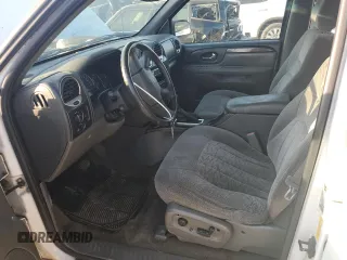 2004 GMC Envoy SLE with VIN 1GKDS13S542233286, listed as a Copart auction lot 76129164 with 228,981 mi miles and Salvage Title. Bid and sale history available at carsss.com. Image 7.