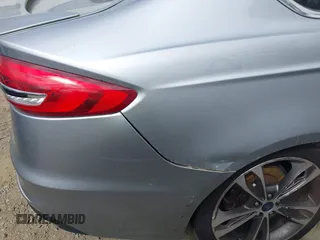 2020 Ford Fusion Titanium с VIN 3FA6P0K91LR128016, выставлен на аукционе IAAI как лот 41947905 с пробегом 79 622 миль миль и . История ставок и продаж доступна на DreamBid. Изображение 6.