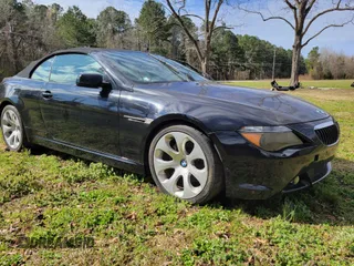 2005 BMW 6 Series 645Ci with VIN WBAEK73445B261180, listed as a IAAI auction lot 41768424 with 128,824 mi miles. Bid and sale history available at carsss.com. Image 1.
