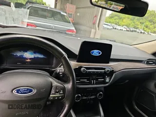2020 Ford Escape Titanium Hybrid with VIN 1FMCU0DZXLUB82146, listed as a IAAI auction lot 42621619 with 112,299 mi miles and . Bid and sale history available at DreamBid. Image 1.