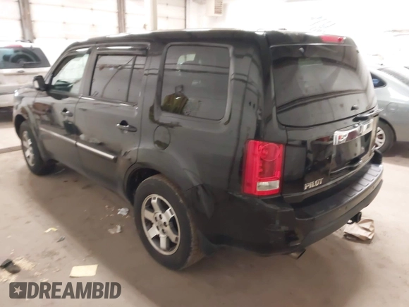 2009 Honda Pilot Touring with VIN 5FNYF48939B041166, listed as a IAAI auction lot 42098397 with 228,305 mi miles and . Bid and sale history available at carsss.com. Image 3.