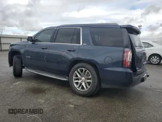 2017 GMC Yukon SLT with VIN 1GKS1BKC5HR295827, listed as a Copart auction lot 48189565 with 106,867 mi miles and Salvage Title. Bid and sale history available at carsss.com. Image 2.