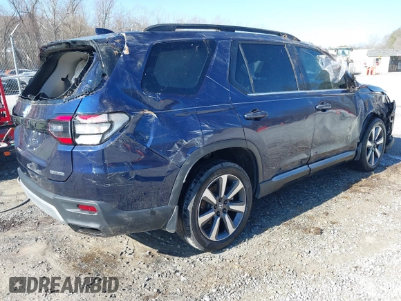 2023 Honda Pilot Touring with VIN 5FNYG2H77PB013559, listed as a IAAI auction lot 41620387 with 59,721 mi miles. Bid and sale history available at carsss.com. Image 4.