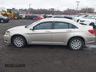 2014 Chrysler 200 LX with VIN 1C3CCBAB2EN213983, listed as a IAAI auction lot 42006774 with 80,615 mi miles and . Bid and sale history available at carsss.com. Image 14.