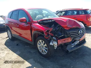 2016 Mazda CX-5 Touring with VIN JM3KE4CY0G0890309, listed as a IAAI auction lot 41890840 with 89,023 mi miles and . Bid and sale history available at carsss.com. Image 1.