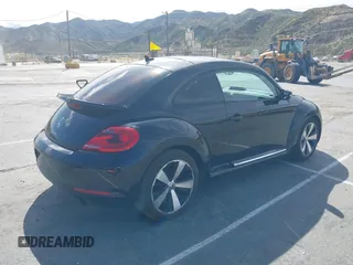 2012 Volkswagen Beetle 2.0T Turbo w/Sun/Snd/Nav PZEV with VIN 3VWVA7AT1CM654881, listed as a IAAI auction lot 41927926 with 71,357 mi miles. Bid and sale history available at carsss.com. Image 4.