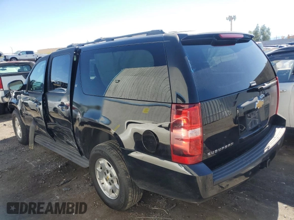 2014 Chevrolet Suburban LT with VIN 1GNSKJE71ER227075, listed as a Copart auction lot 76675654 with 214,113 mi miles and Salvage Title. Bid and sale history available at DreamBid. Image 2.