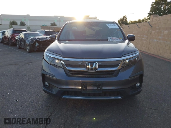 2021 Honda Pilot EX-L with VIN 5FNYF5H54MB018846, listed as a IAAI auction lot 41208987 with 80,757 mi miles and . Bid and sale history available at DreamBid. Image 12.