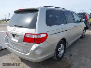 2005 Honda Odyssey EX-L with VIN 5FNRL38745B126338, listed as a IAAI auction lot 41991119 with 165,552 mi miles. Bid and sale history available at carsss.com. Image 4.