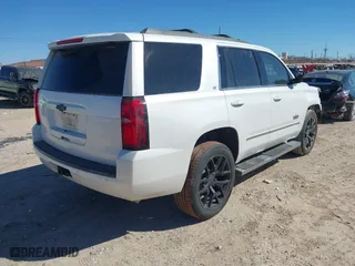 2018 Chevrolet Tahoe LT with VIN 1GNSCBKC8JR128476, listed as a IAAI auction lot 41447799 with 105,209 mi miles. Bid and sale history available at carsss.com. Image 4.