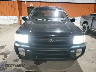 2000 Infiniti QX4 z VIN JNRAR07Y6YW080306, wystawiony jako Copart lot #85022064 z przebiegiem 278 383 mil mil oraz Tytuł czysty. Historia ofert i sprzedaży dostępna na DreamBid. Obrazek 5.