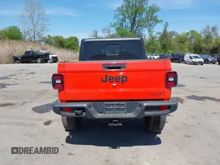 2020 Jeep Gladiator Sport S z VIN 1C6HJTAG0LL149161, wystawiony jako IAAI lot #42071132 z przebiegiem 153 062 mil mil oraz . Historia ofert i sprzedaży dostępna na DreamBid. Obrazek 16.