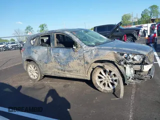 2013 Mazda CX-5 Grand Touring with VIN JM3KE2DEXD0130585, listed as a IAAI auction lot 42001388 with 66,348 mi miles. Bid and sale history available at carsss.com. Image 13.