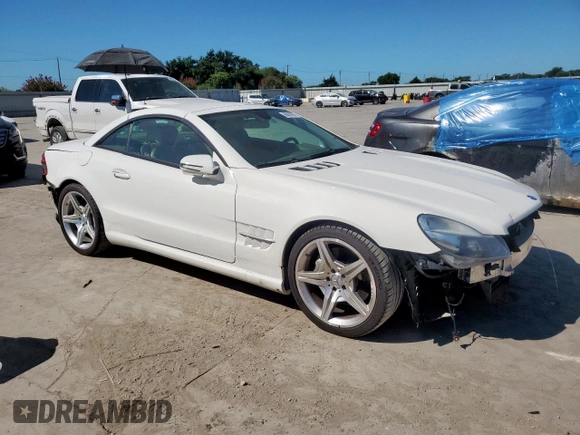 2009 Mercedes-Benz SL 550 with VIN WDBSK71F69F147589, listed as a Copart auction lot 65976995 with 77,387 mi miles and Salvage title. Bid and sale history available at DreamBid. Image 4.