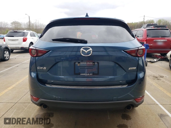 2018 Mazda CX-5 Grand Touring with VIN JM3KFADM8J1351624, listed as a Copart auction lot 50965465 with 66,210 mi miles and Salvage Title. Bid and sale history available at DreamBid. Image 6.